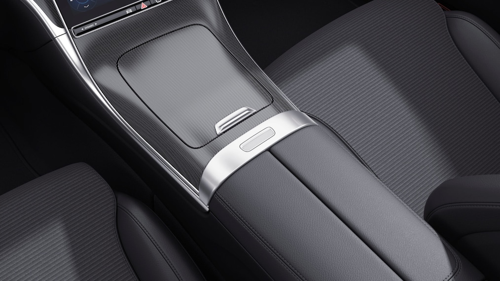 Dynamic view of a Mercedes-Benz C-Class Saloon (driving shot) or standing at a charging station.