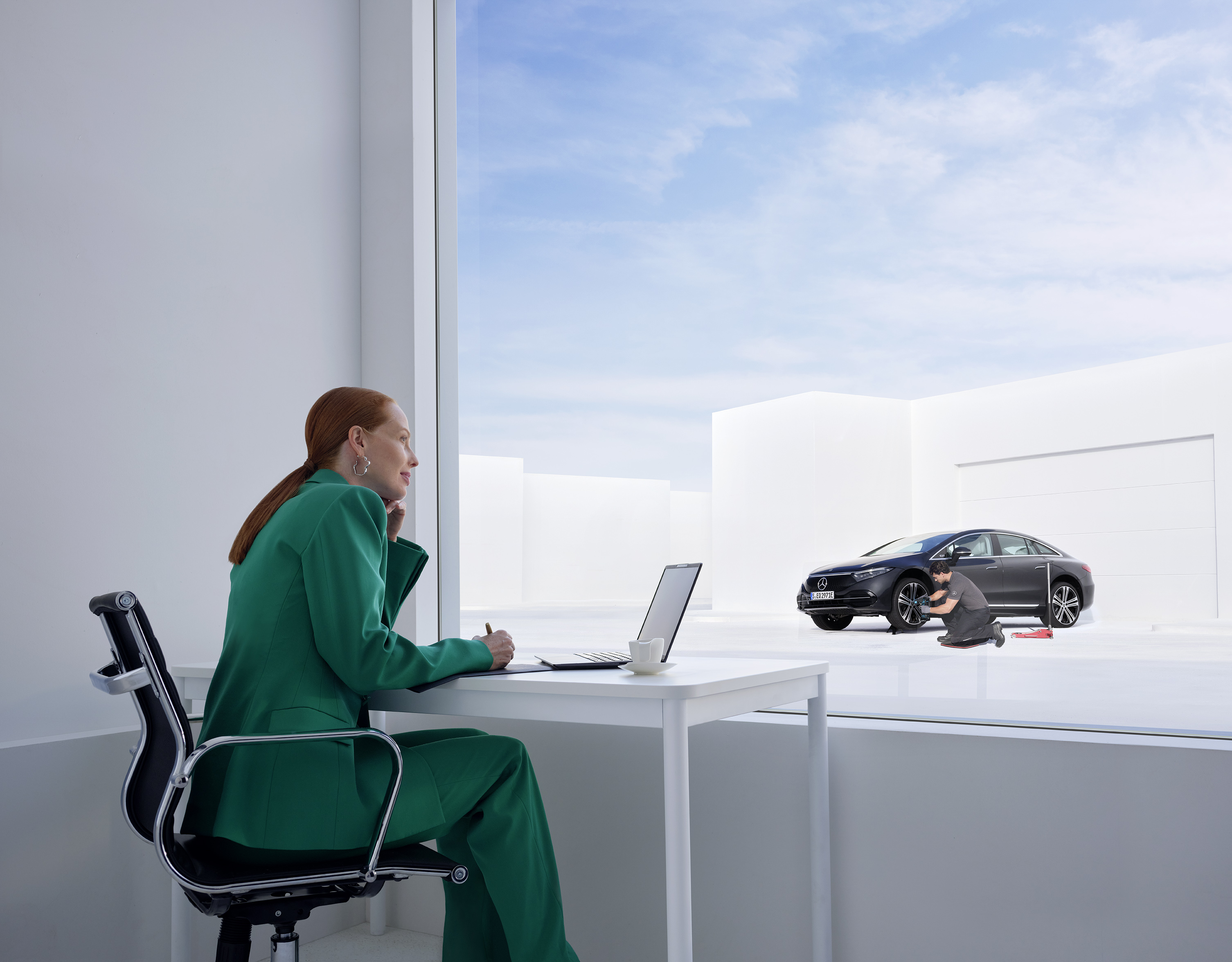 Damage and Breakdown | Mercedes-Benz Woman leaning on her Mercedes-Benz on the phone.