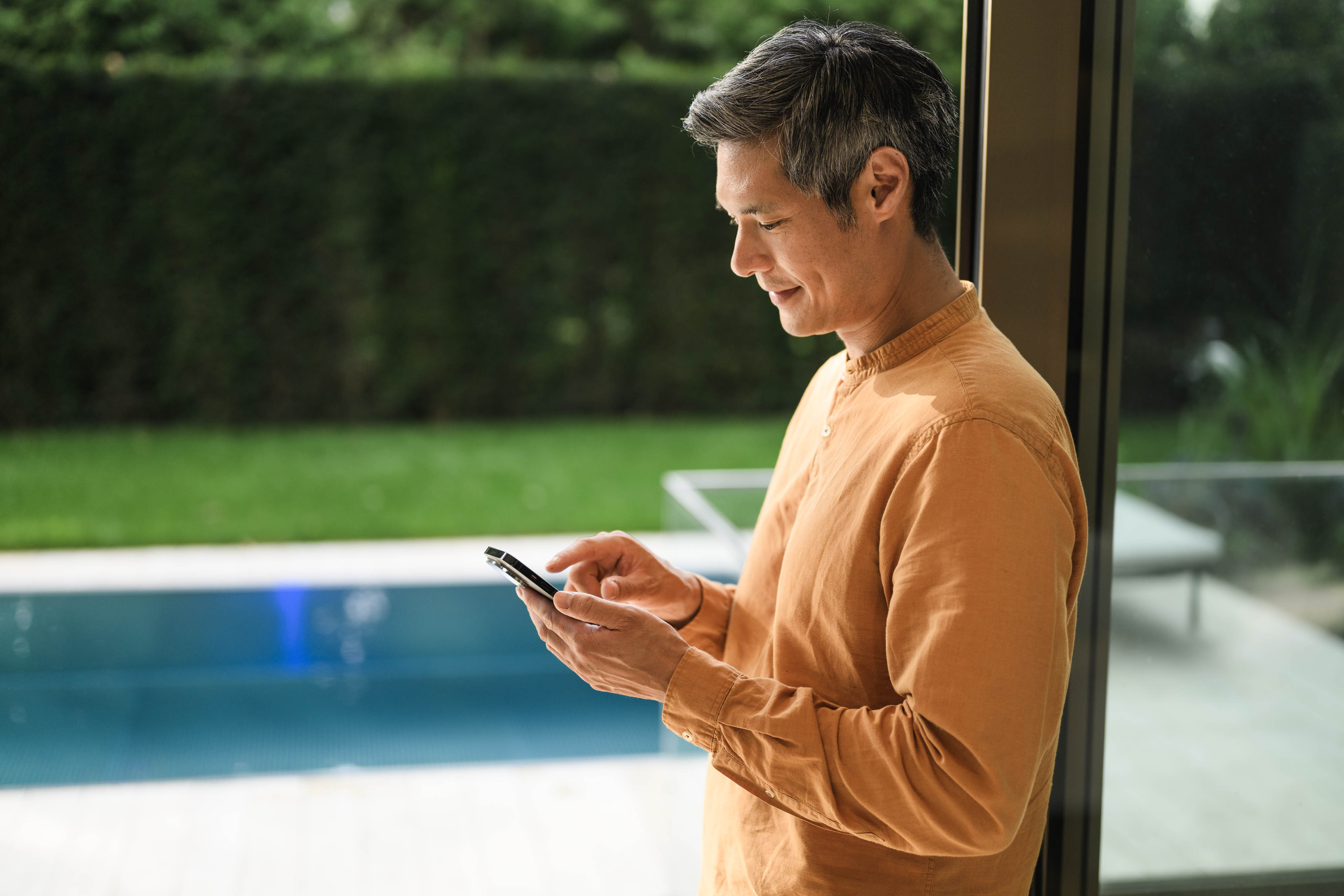 Payment estimator for your Mercedes-Benz A person using their mobile device.