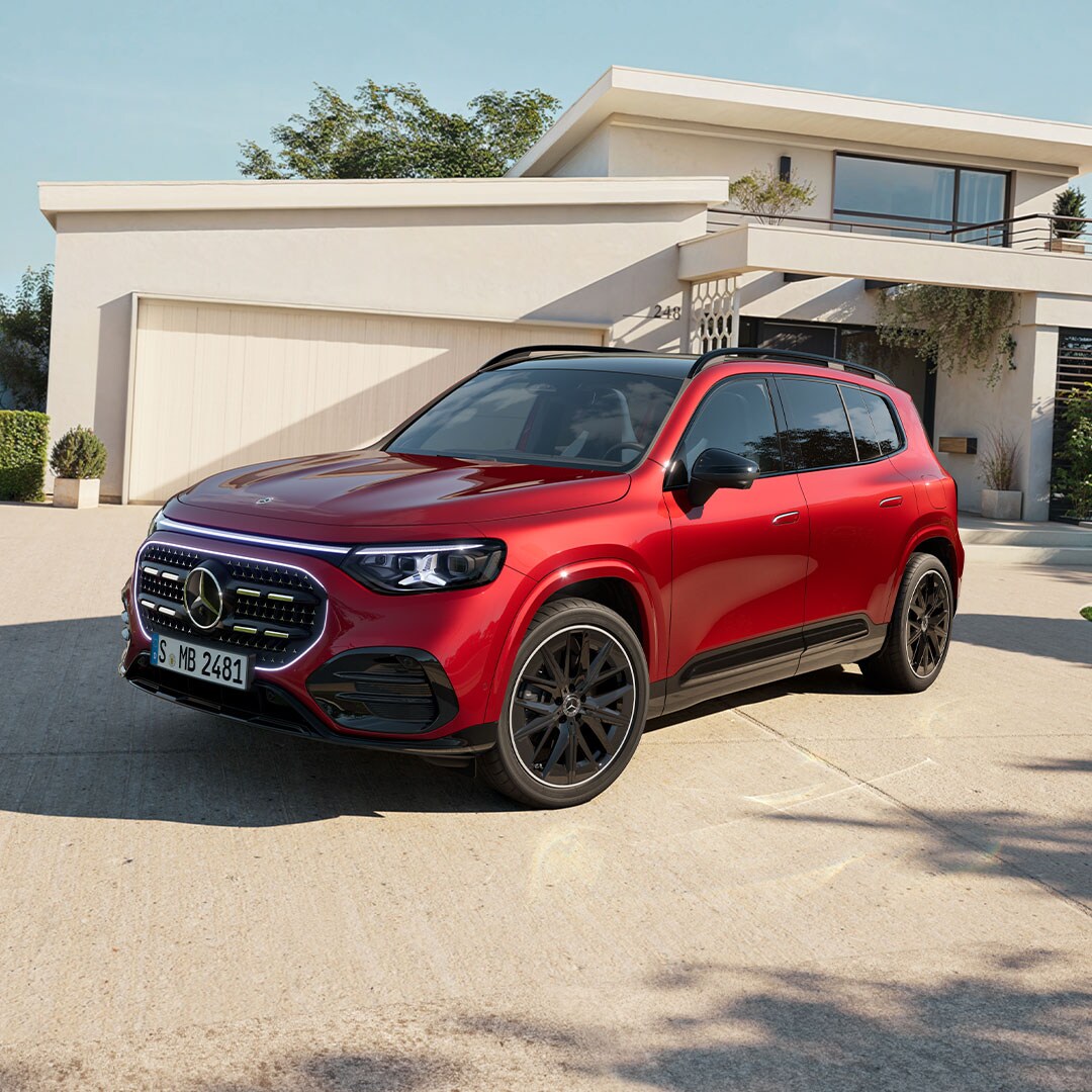 The Mercedes-Benz GLB Intelligent Hybrid SUV featuring 48V hybrid technology, shown in front of a modern home.
