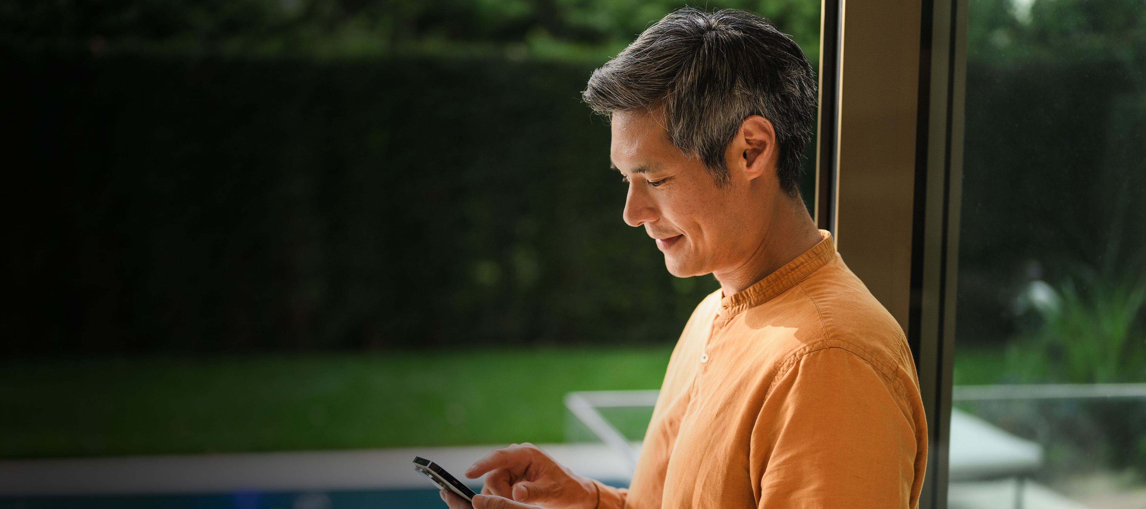 Insurance for your Mercedes-Benz A person using their mobile device.