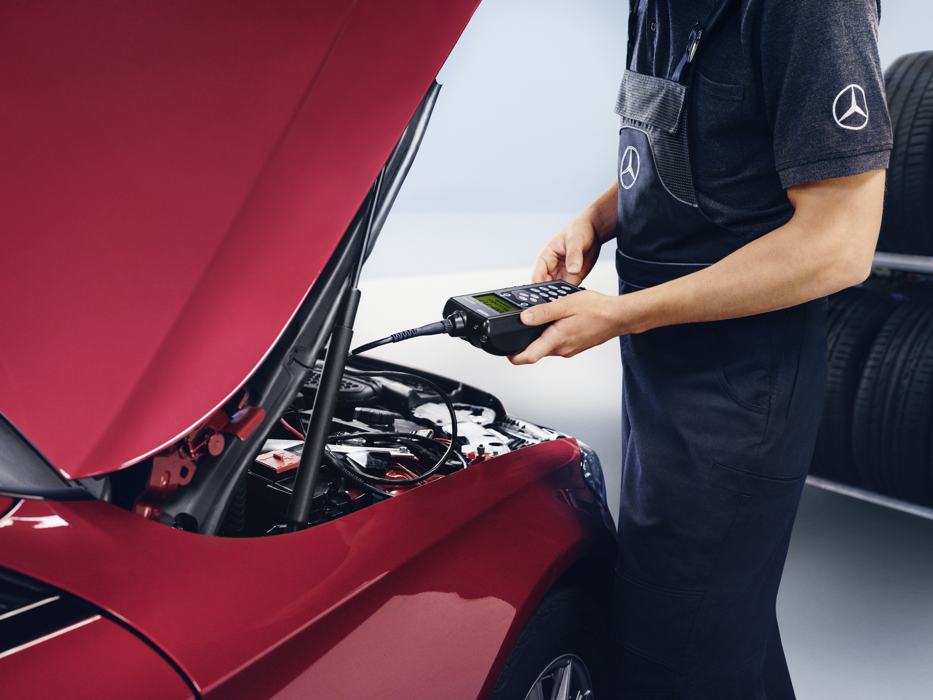 On-board battery | Mercedes-Benz A technician making the settings on the battery.