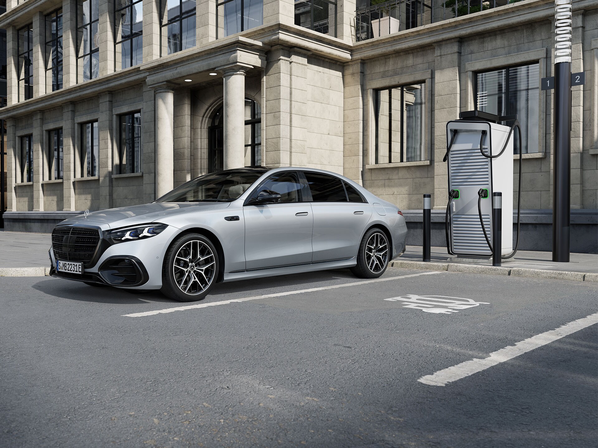 The Mercedes-Benz S-Class Saloon Long Plug-in hybrid in a seven-eight sideview, standing in a parking lot next to a charging station.