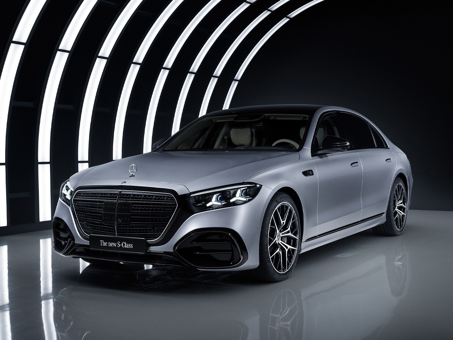 The Mercedes-Benz S-Class in a studio with an illuminated arc.