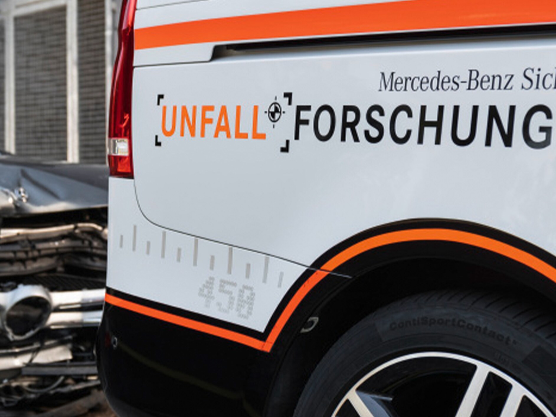 Mercedes-Benz car with "Accident research" printed on ist side.