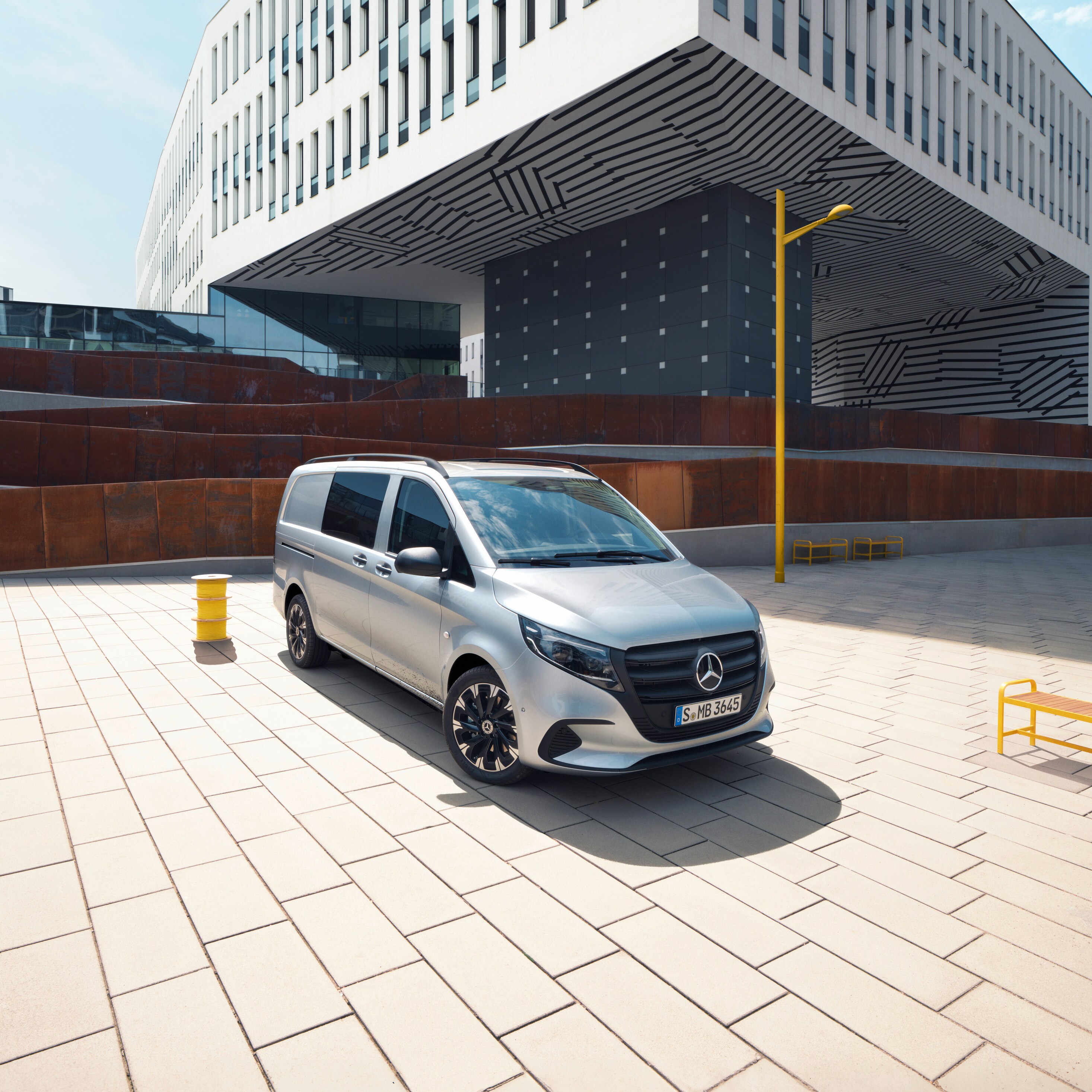 The Vito Mixto in front of a business building.