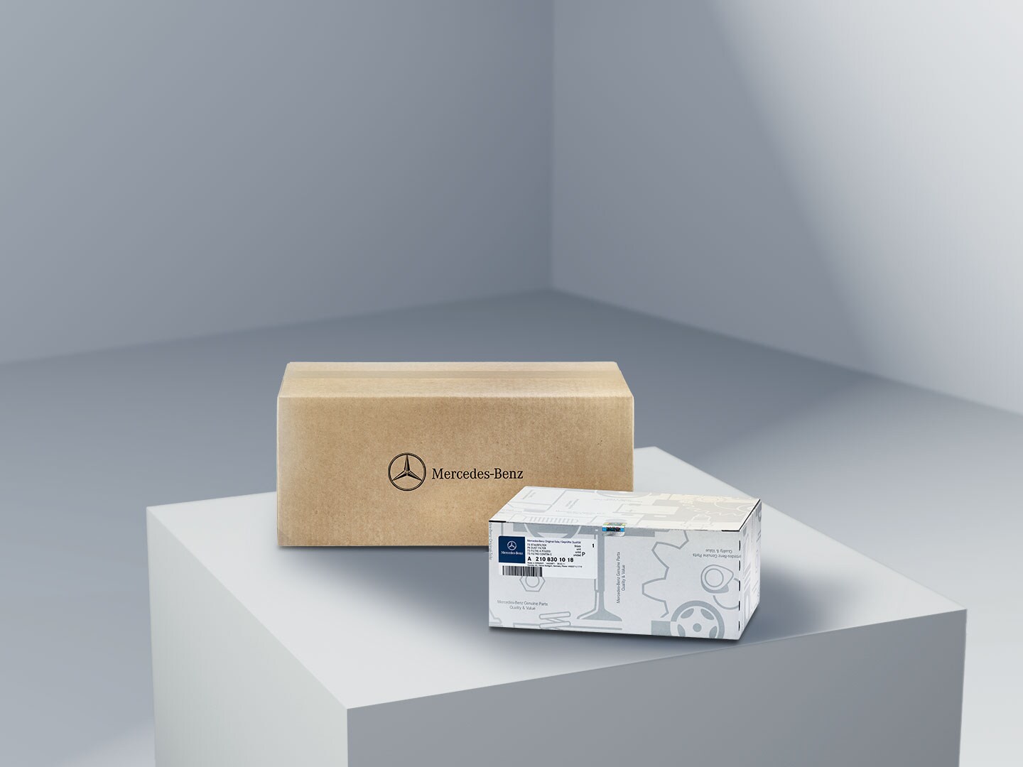 Two unopened boxes containing Mercedes-Benz Genuine Parts.