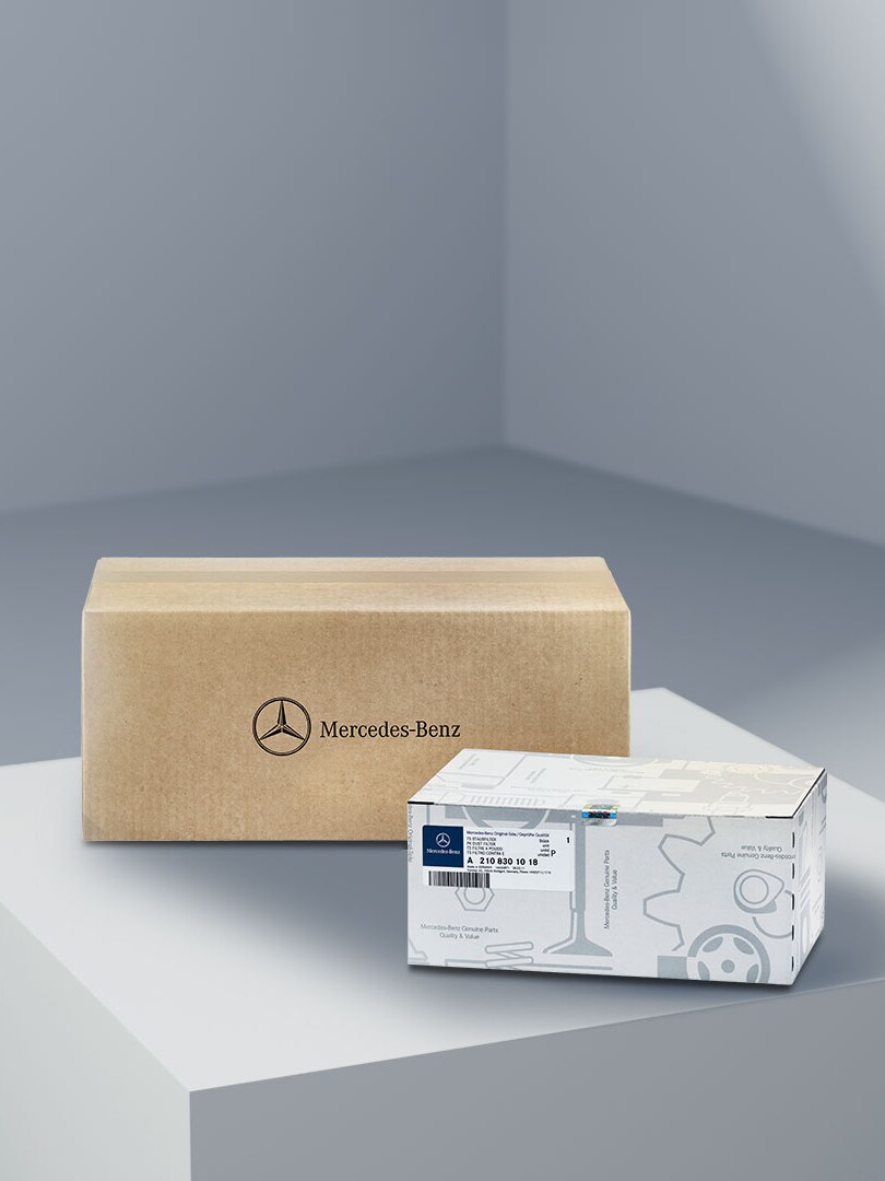 Two unopened boxes containing Mercedes-Benz Genuine Parts.