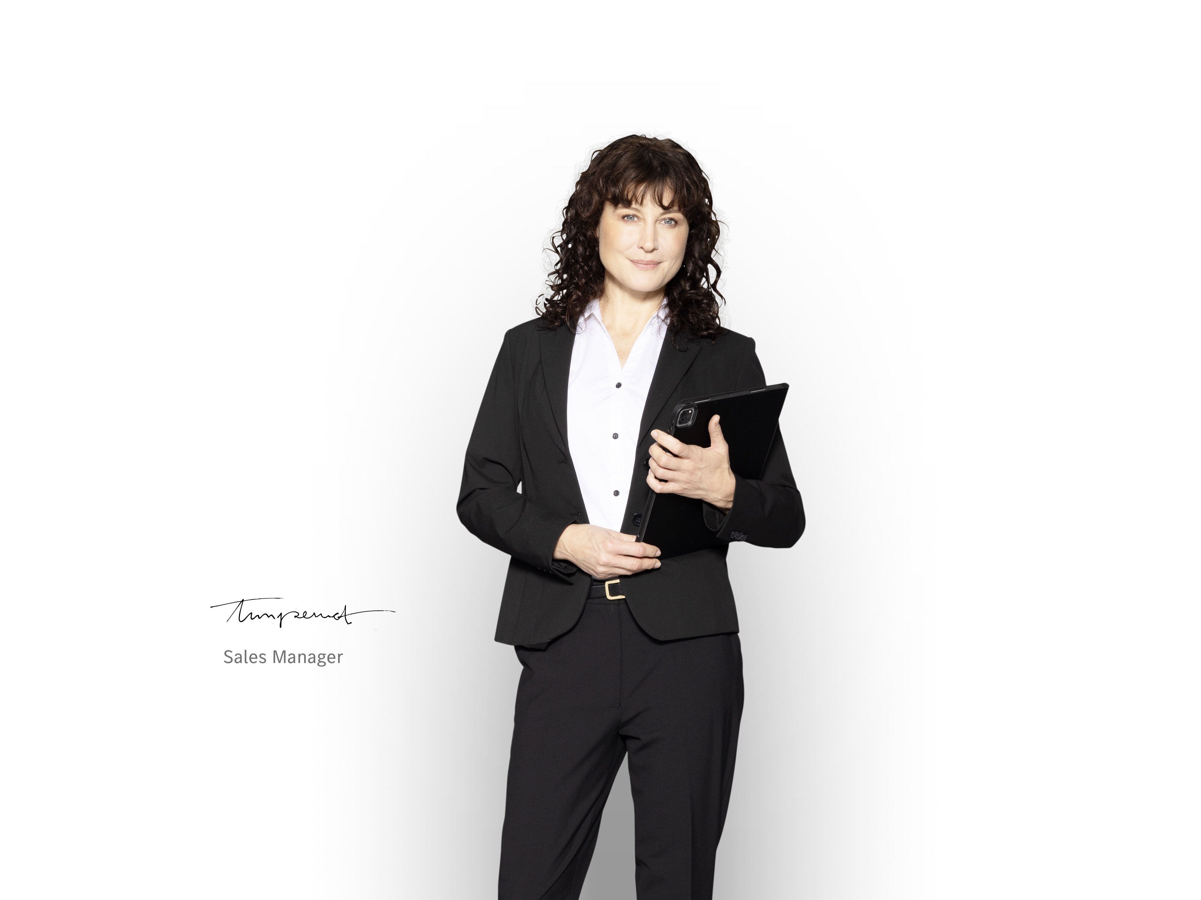 Mercedes-Benz Sales Manager with a tablet ready to inform about the service packages.